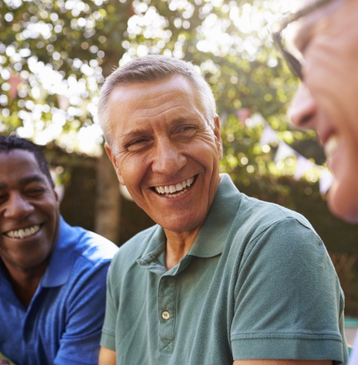 Group of men smiling together outdoors