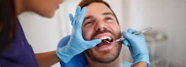 Man receiving a dental checkup