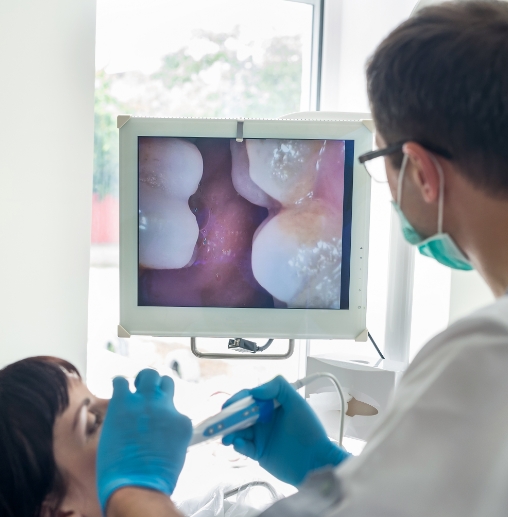 Dentist taking intraoral photos of a patients teeth