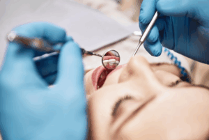 Close up of dentist examining a patient’s mouth